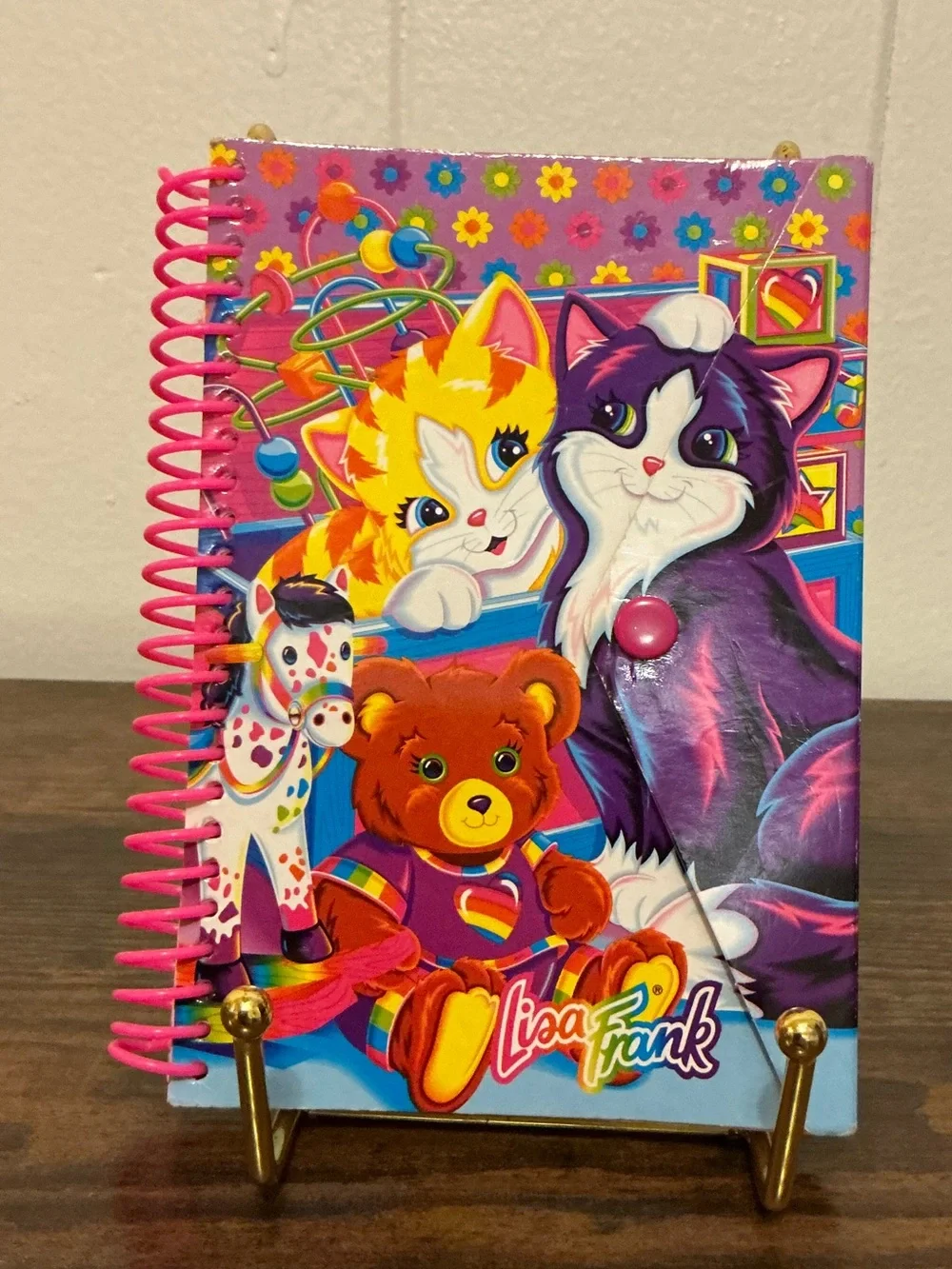A vintage 1990s Lisa Frank snap mini notebook features colorful Playtime Kittens
